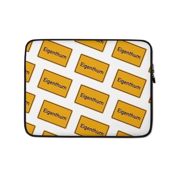 Eine Eigenthum Laptop-Tasche mit einem gelben Muster darauf.