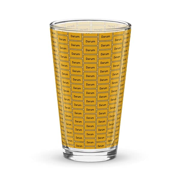 Ein Darum Pint-Glas mit einem leuchtend gelben Muster.
